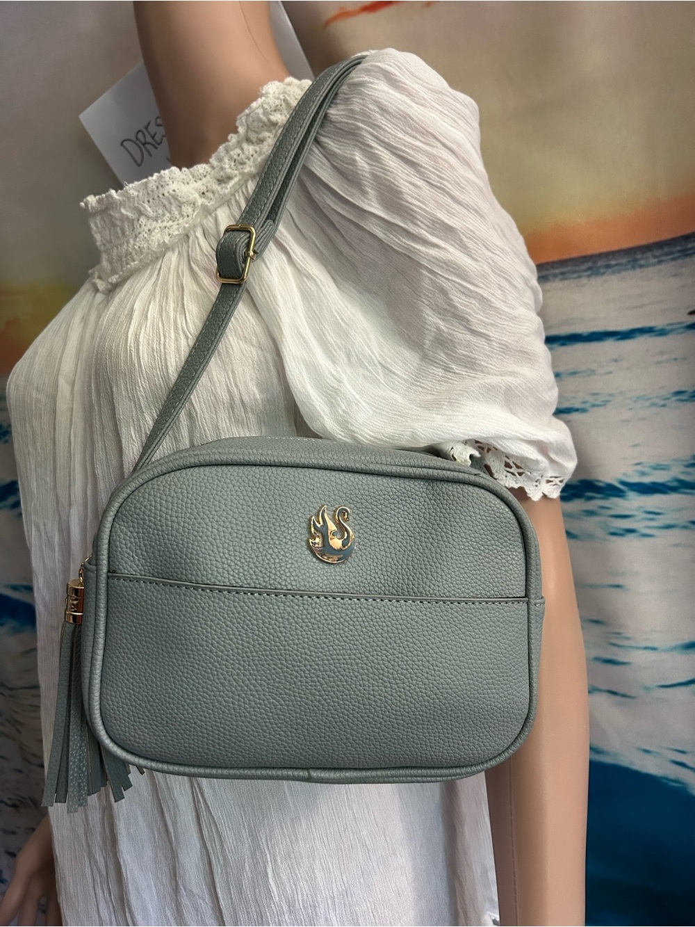 Gloria Vanderbilt Women’s Light Blue Pebbled Faux Leather Crossbody Bag Tassel